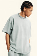 Heavyweight Distressed-Wash Cotton T-Shirt in Light Gray - front modeled view