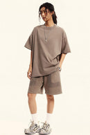 Heavyweight Distressed-Wash Cotton T-Shirt in Mud - full-length front modeled view