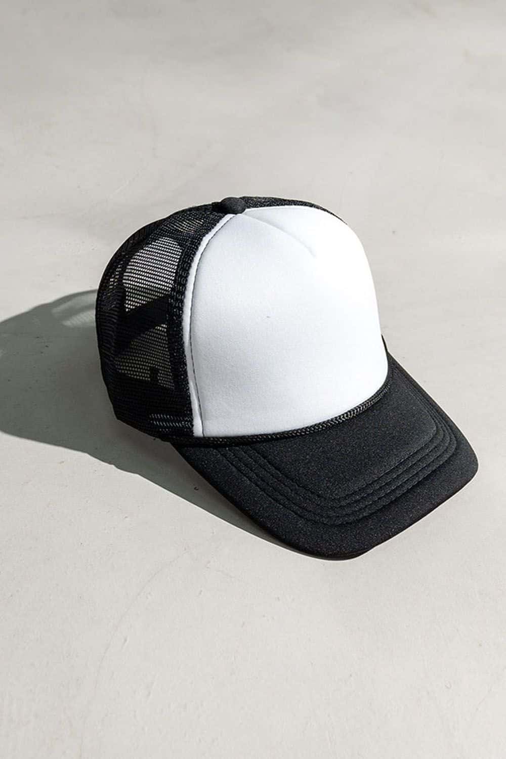 Rope-Trim Panelled Mesh Trucker Cap with Top Button in Black And White - product detail view