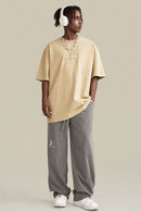 Vintage-Wash Heavyweight Cotton Oversized Crew-Neck T-Shirt in Khaki - full-length front modeled view