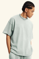 Washed Raw-Edge Heavyweight Cotton T-Shirt in Light Gray - three-quarter front modeled view
