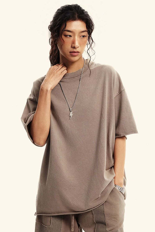 Washed Raw-Edge Heavyweight Cotton T-Shirt in Mud - three-quarter front modeled view