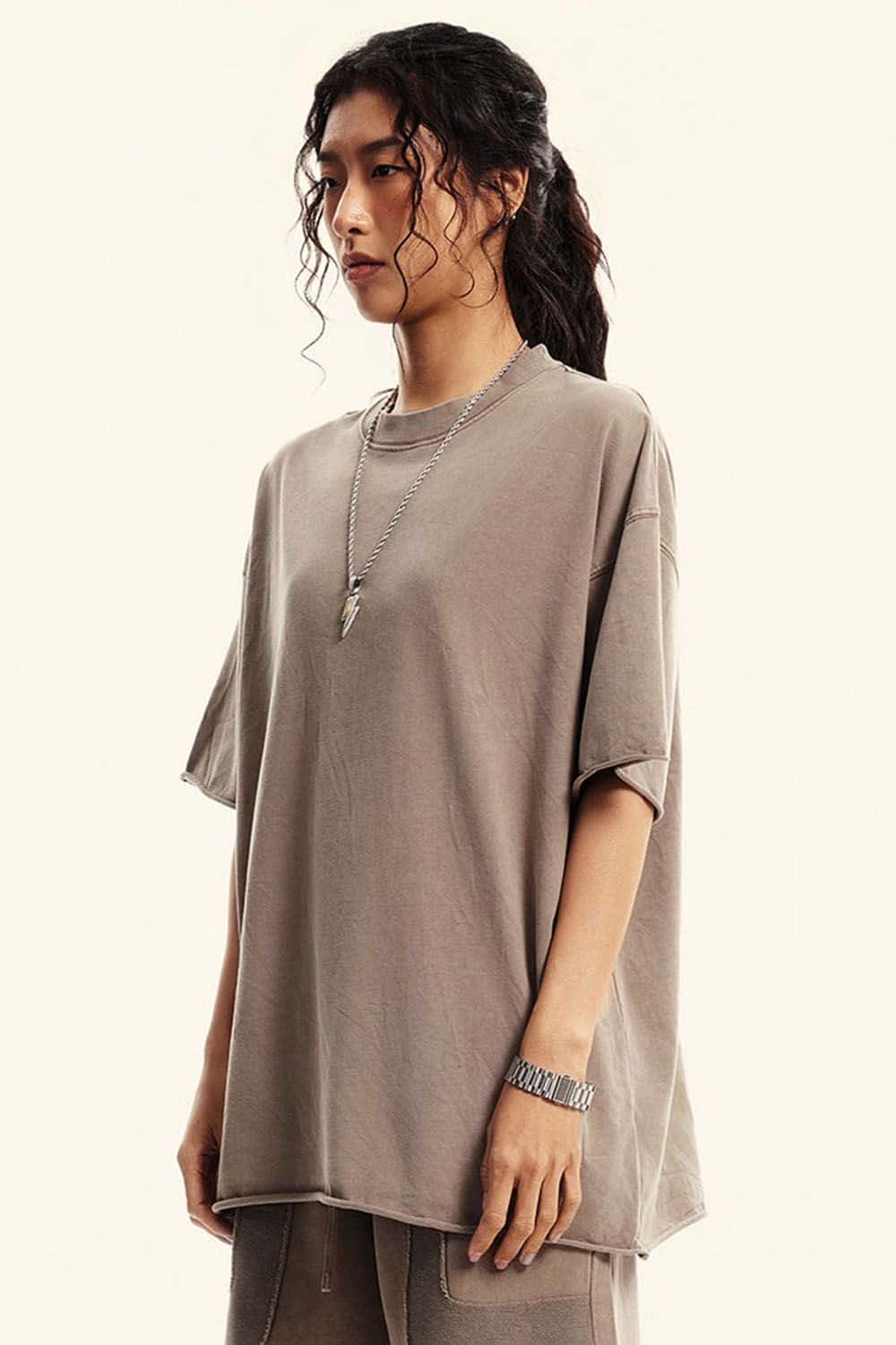 Washed Raw-Edge Heavyweight Cotton T-Shirt in Mud - three-quarter front modeled view