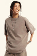 Washed Raw-Edge Heavyweight Cotton T-Shirt in Mud - three-quarter front modeled view