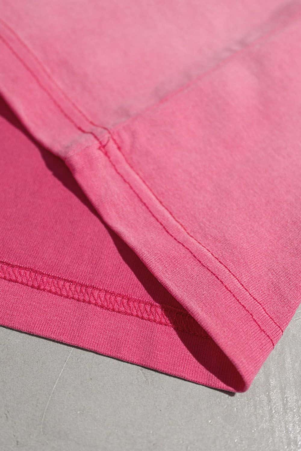 Washed Typographic Graphic Cotton Long-Sleeve T-Shirt in Rose Red - cuff and hem detail