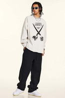 Crossed-Scissors Graphic Long-Sleeve Tee in Sandy Apricot - full-length front modeled view