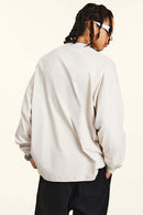 Crossed-Scissors Graphic Long-Sleeve Tee in Sandy Apricot - product detail close-up