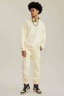 Heavyweight Brushed Fleece Relaxed Crew-Neck Sweatshirt in Cream Apricot - full-length front modeled view