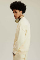 Heavyweight Brushed Fleece Relaxed Crew-Neck Sweatshirt in Cream Apricot - side modeled view