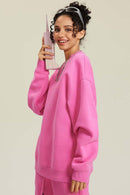Heavyweight Brushed Fleece Relaxed Crew-Neck Sweatshirt in Rose Pink - side modeled view