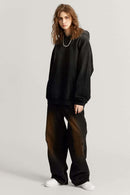 Ultra-Heavyweight Gradient-Wash Distressed Hoodie in Active Black - full-length front modeled view
