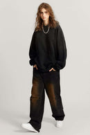 Ultra-Heavyweight Gradient-Wash Distressed Hoodie in Active Black - full-length front modeled view