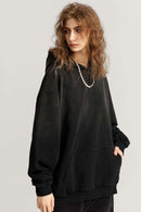 Ultra-Heavyweight Gradient-Wash Distressed Hoodie in Active Black - three-quarter front modeled view