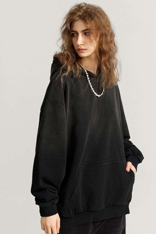Ultra-Heavyweight Gradient-Wash Distressed Hoodie in Active Black - three-quarter front modeled view