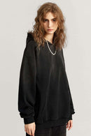 Ultra-Heavyweight Gradient-Wash Distressed Hoodie in Active Black - three-quarter front modeled view