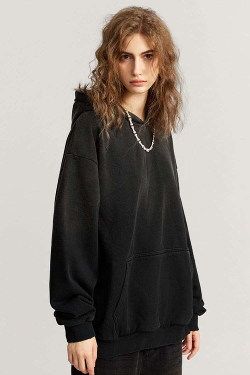 Ultra-Heavyweight Gradient-Wash Distressed Hoodie in Active Black - three-quarter front modeled view