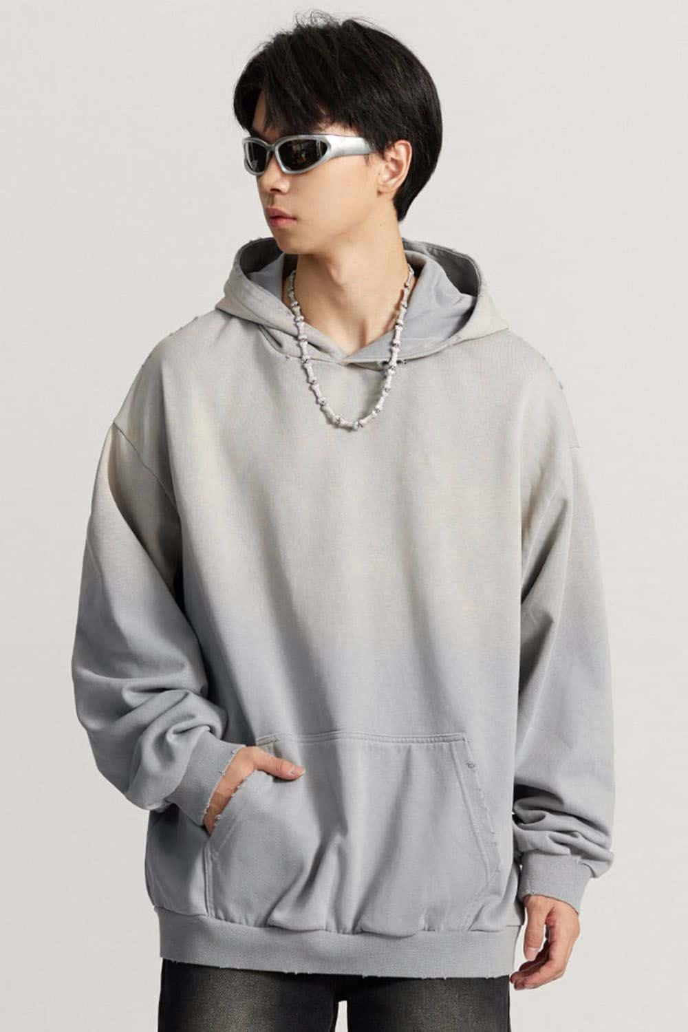 Ultra-Heavyweight Gradient-Wash Distressed Hoodie in Medium Gray - three-quarter front modeled view