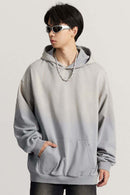 Ultra-Heavyweight Gradient-Wash Distressed Hoodie in Medium Gray - three-quarter front modeled view