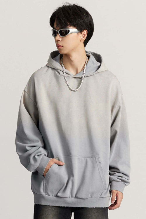 Ultra-Heavyweight Gradient-Wash Distressed Hoodie in Medium Gray - three-quarter front modeled view