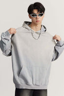Ultra-Heavyweight Gradient-Wash Distressed Hoodie in Medium Gray - front modeled close-up