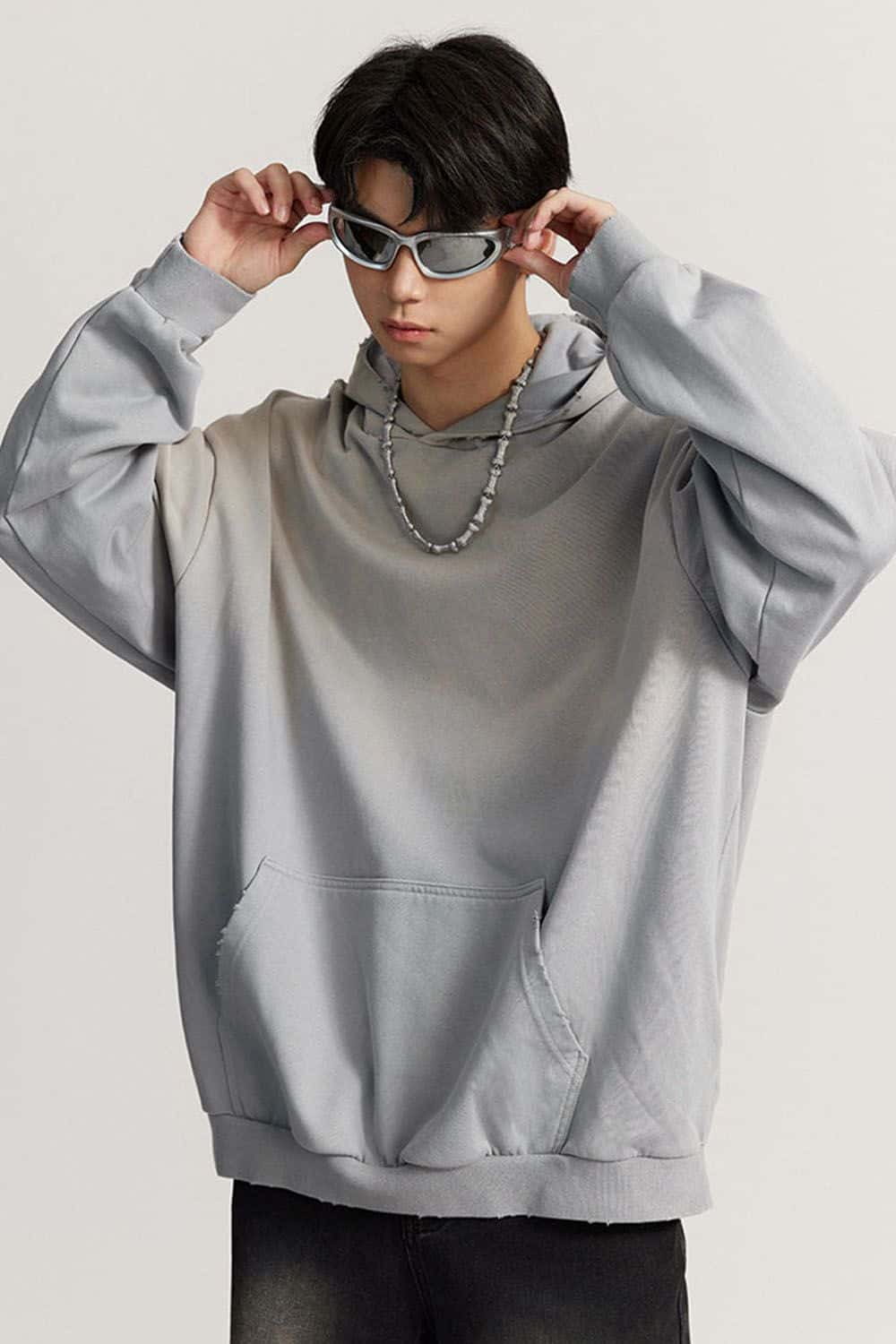 Ultra-Heavyweight Gradient-Wash Distressed Hoodie in Medium Gray - front modeled close-up