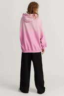 Ultra-Heavyweight Gradient-Wash Distressed Hoodie in Rose Pink - full-length back modeled view