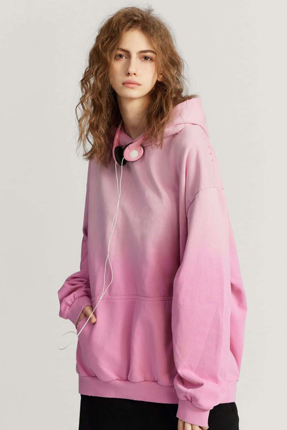 Ultra-Heavyweight Gradient-Wash Distressed Hoodie in Rose Pink - three-quarter front modeled view