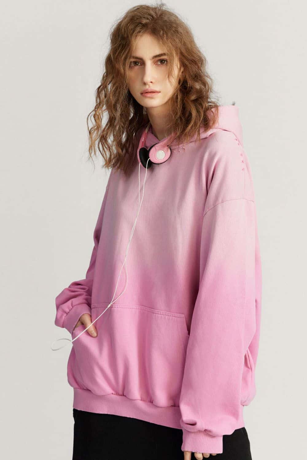 Ultra-Heavyweight Gradient-Wash Distressed Hoodie in Rose Pink - three-quarter front modeled view