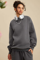 Washed Fleece-Lined Relaxed Crew-Neck Sweatshirt in Dark Gray - front modeled close-up