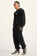 Washed Fleece-Lined Relaxed Crew-Neck Sweatshirt in Fried Snowflakes - full-length side modeled view