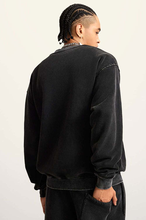 Washed Fleece-Lined Relaxed Crew-Neck Sweatshirt in Fried Snowflakes - back modeled view