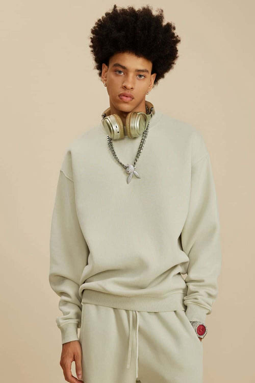 Washed Fleece-Lined Relaxed Crew-Neck Sweatshirt in Gray Apricot - three-quarter front modeled view