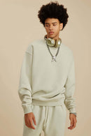 Washed Fleece-Lined Relaxed Crew-Neck Sweatshirt in Gray Apricot - three-quarter front modeled view
