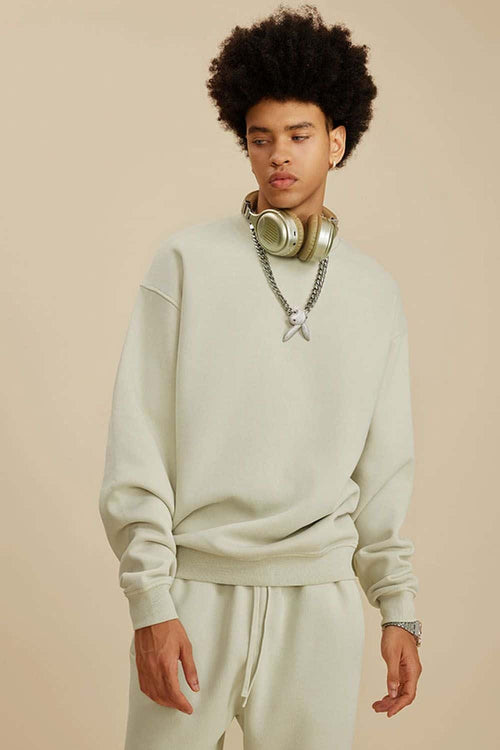 Washed Fleece-Lined Relaxed Crew-Neck Sweatshirt in Gray Apricot - three-quarter front modeled view