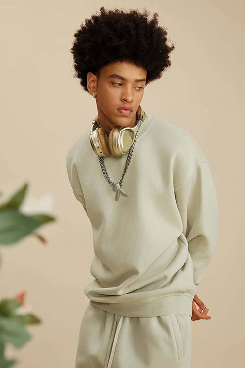 Washed Fleece-Lined Relaxed Crew-Neck Sweatshirt in Gray Apricot - three-quarter front modeled view
