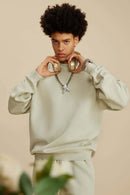 Washed Fleece-Lined Relaxed Crew-Neck Sweatshirt in Gray Apricot - three-quarter front modeled view