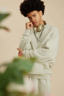 Washed Fleece-Lined Relaxed Crew-Neck Sweatshirt in Gray Apricot - three-quarter front modeled view