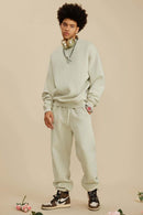 Washed Fleece-Lined Relaxed Crew-Neck Sweatshirt in Gray Apricot - full-length front modeled view