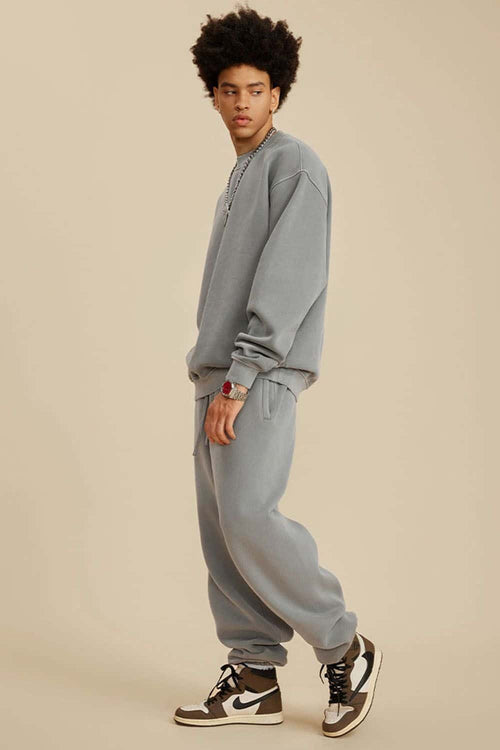 Washed Fleece-Lined Relaxed Crew-Neck Sweatshirt in Medium Gray - full-length side modeled view
