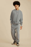 Washed Fleece-Lined Relaxed Crew-Neck Sweatshirt in Medium Gray - full-length front modeled view
