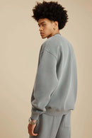 Washed Fleece-Lined Relaxed Crew-Neck Sweatshirt in Medium Gray - back modeled view
