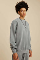 Washed Fleece-Lined Relaxed Crew-Neck Sweatshirt in Medium Gray - three-quarter front modeled view