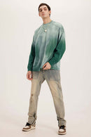 Washed Drop-Shoulder Long-Sleeve Cotton T-Shirt in Green - full-length front modeled view