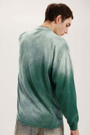 Washed Drop-Shoulder Long-Sleeve Cotton T-Shirt in Green - back modeled view