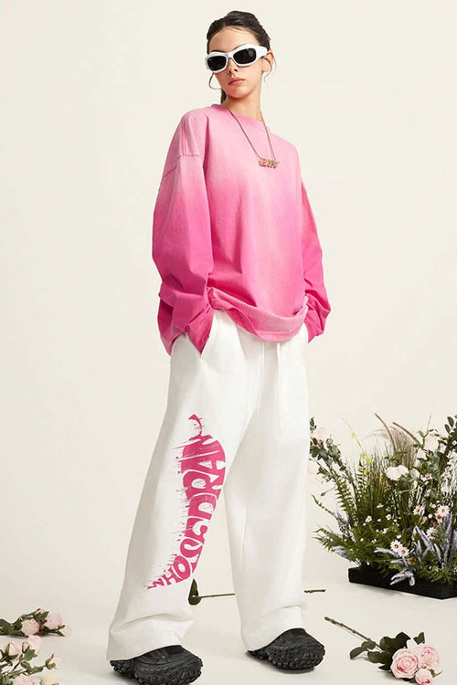 Washed Drop-Shoulder Long-Sleeve Cotton T-Shirt in Rose Red - full-length front modeled view