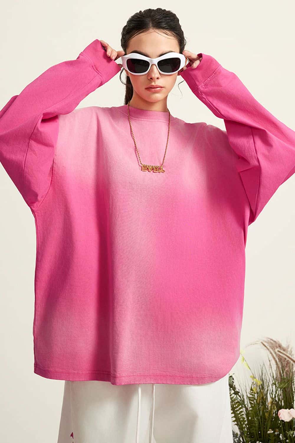 Washed Drop-Shoulder Long-Sleeve Cotton T-Shirt in Rose Red - front modeled close-up
