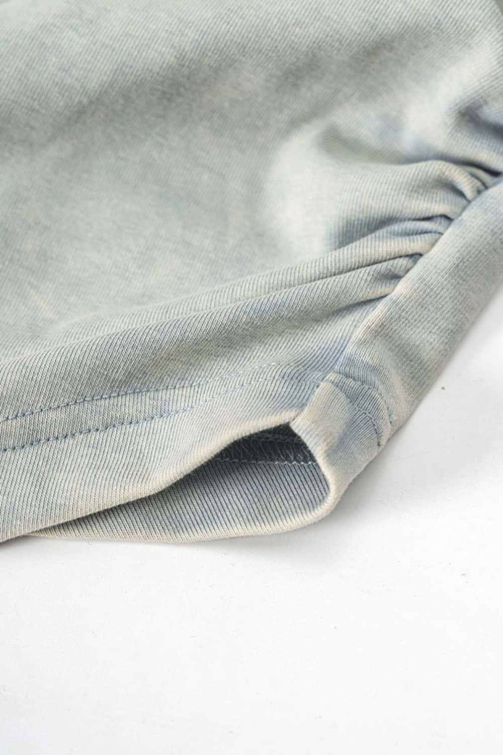 Ruched Asymmetric-Hem Fitted Cotton-Blend Sleeveless Top in Haze Blue - hem detail