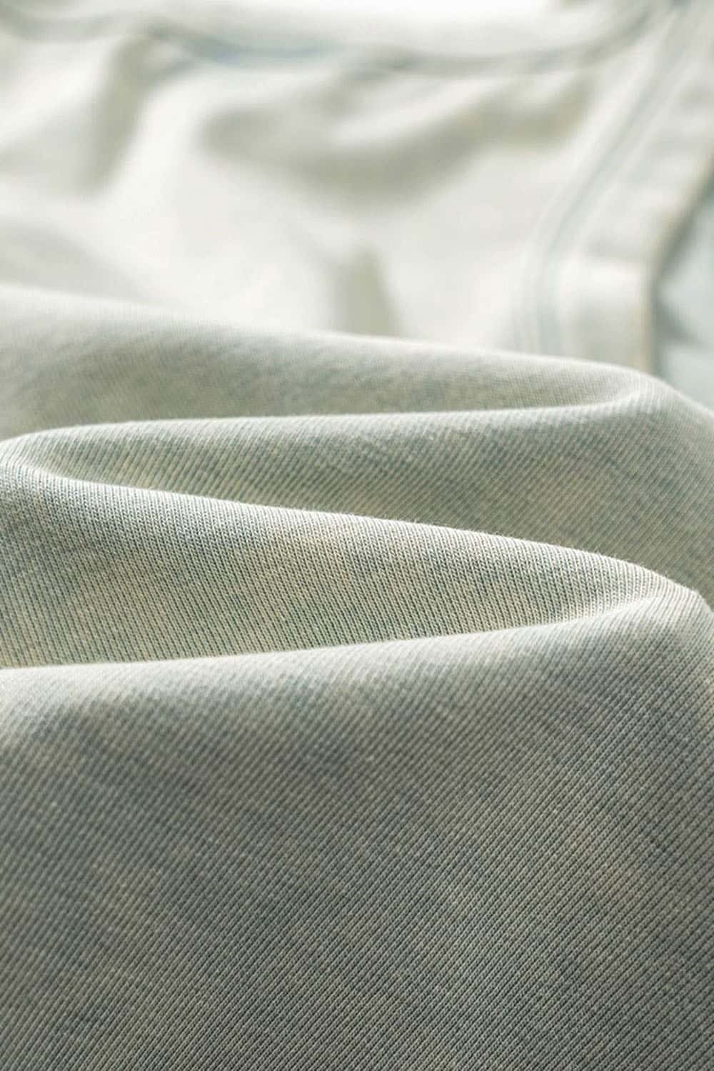 Ruched Asymmetric-Hem Fitted Cotton-Blend Sleeveless Top in Haze Blue - fabric texture close-up