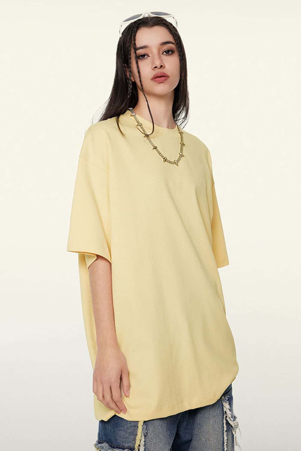 Ultra-Heavyweight Drop-Shoulder T-Shirt in Cream Apricot - three-quarter front modeled view