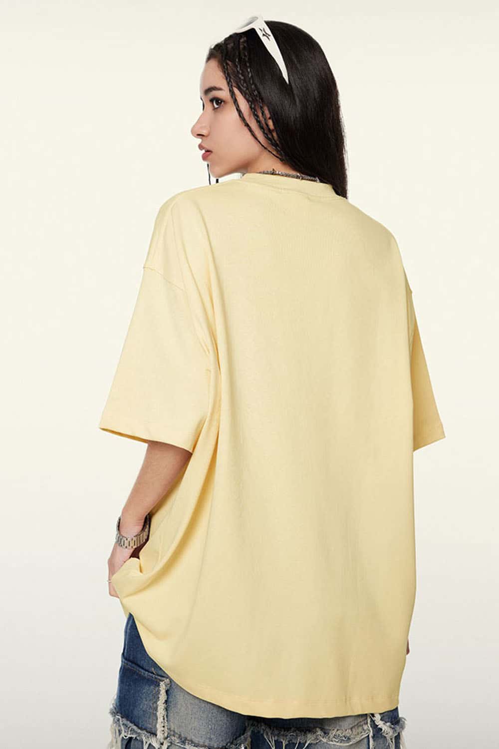 Ultra-Heavyweight Drop-Shoulder T-Shirt in Cream Apricot - rear three-quarter modeled view